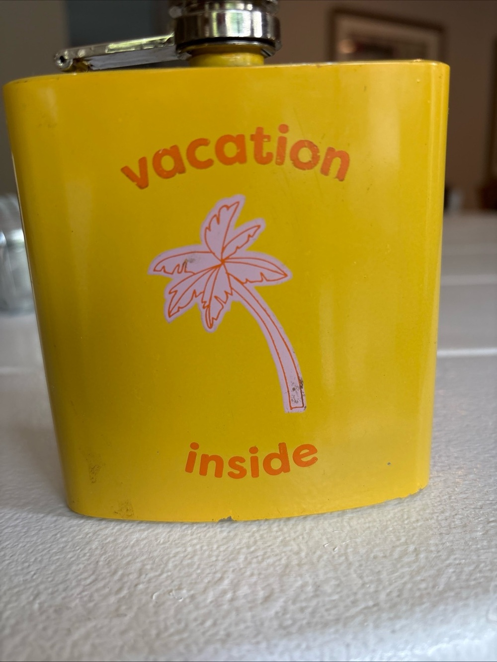 Urban outfitter’s Yellow 'Vacation Inside' Palm Tree Flask screw top closure